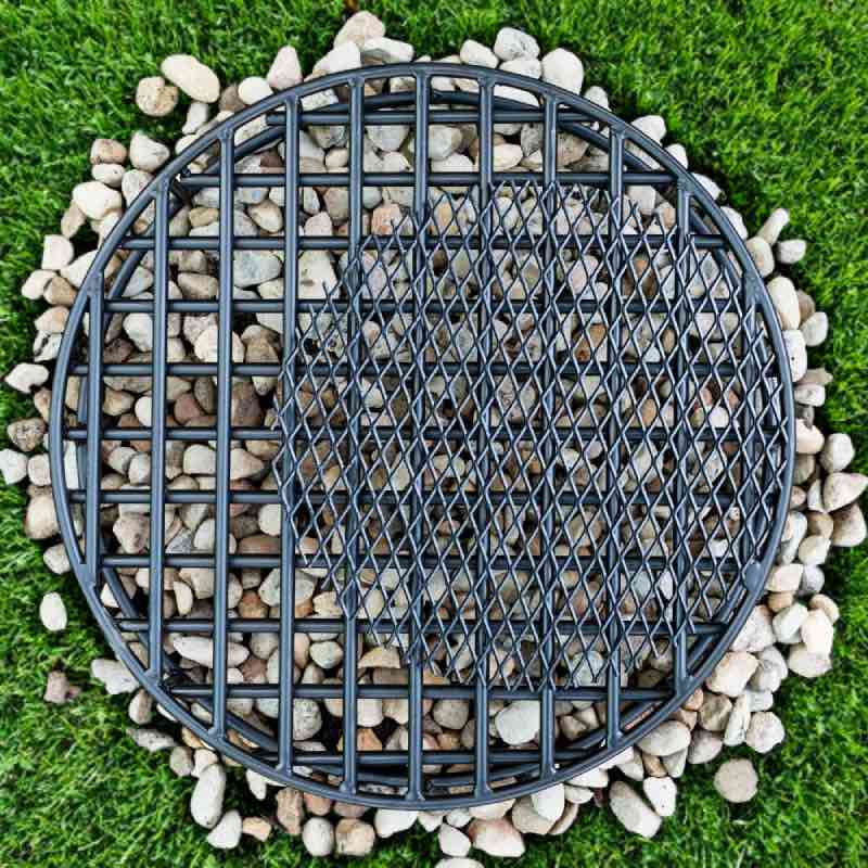 Place teh EMber Catcher to the side of the fire grate to offset the heart of the fire for cooking