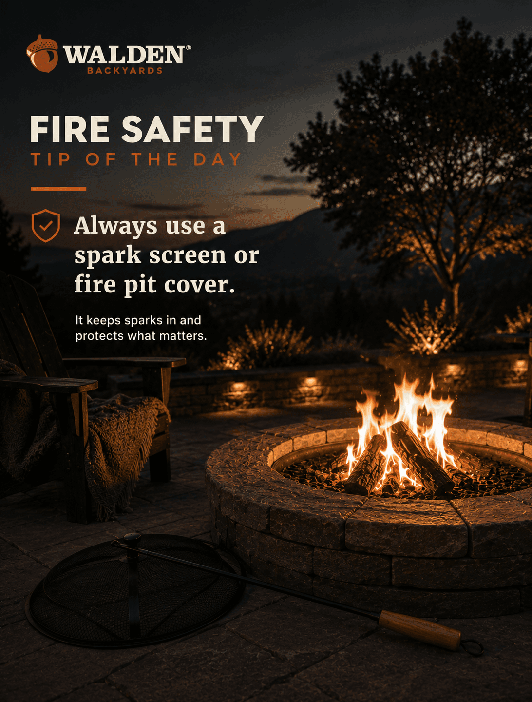 A spark screen resting beside a stone fire pit at dusk