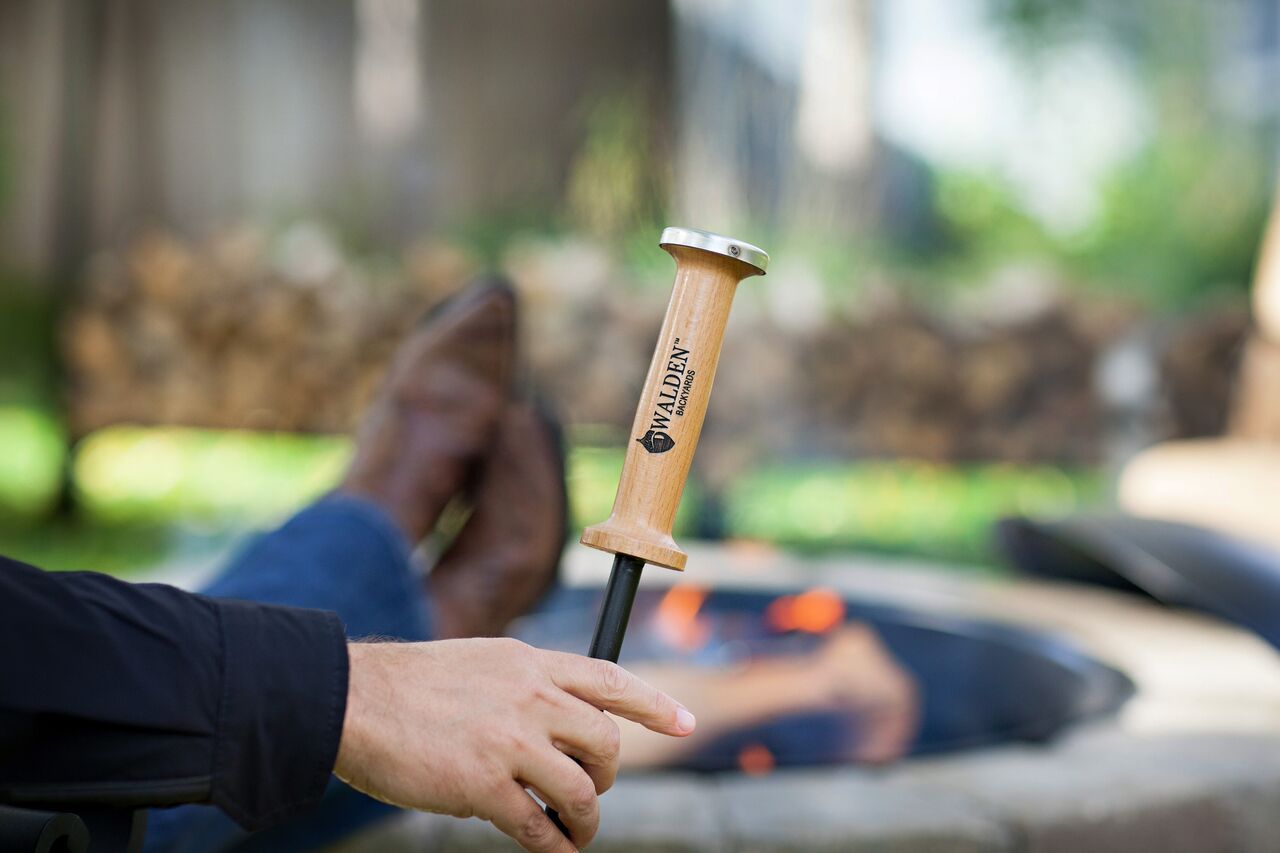 Fire Stoker-Poker next to a fire pit