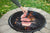 Cooking steak over an open fire