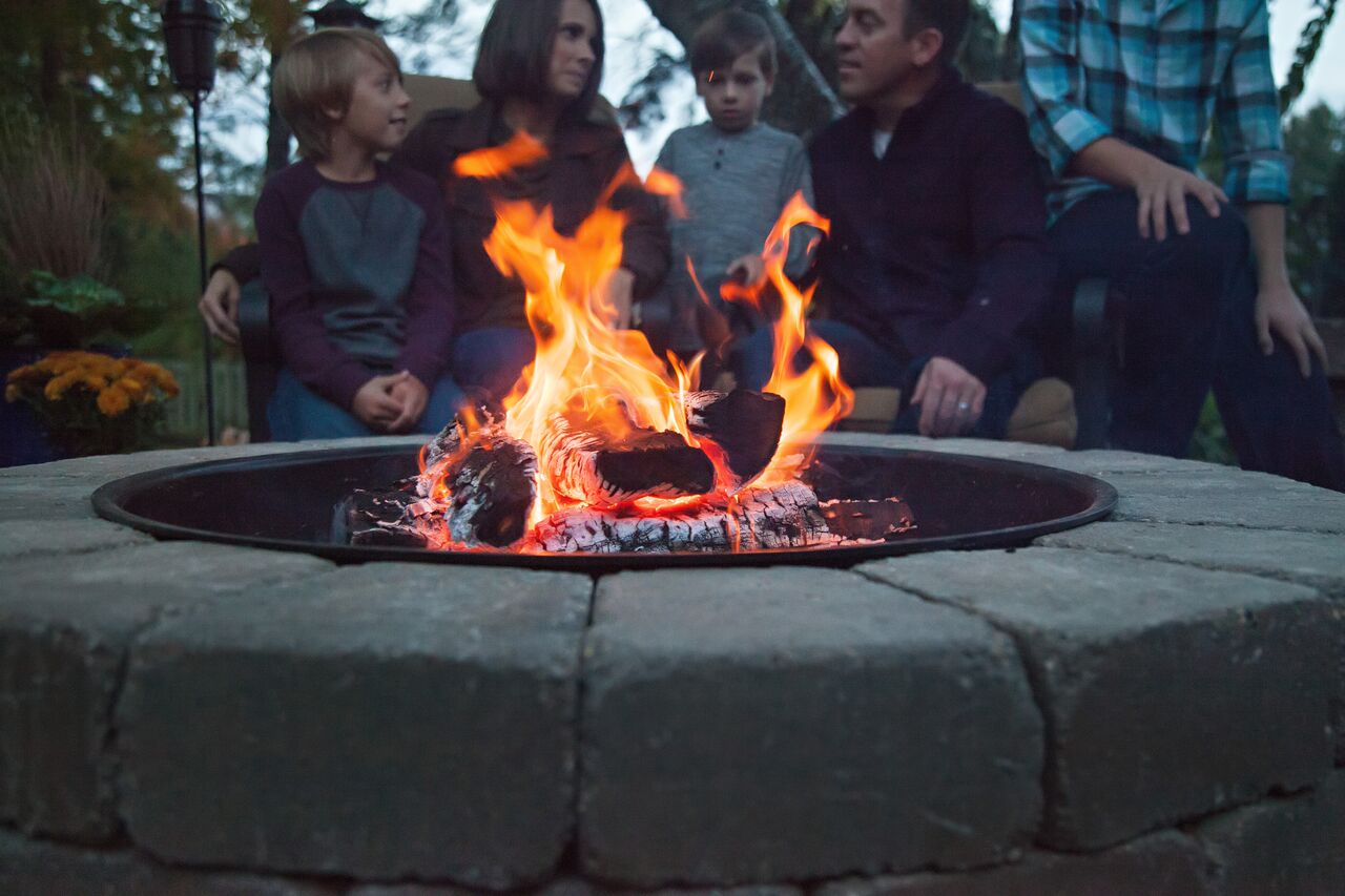 Family gathered around a bonfire