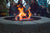 Family gathered around a bonfire