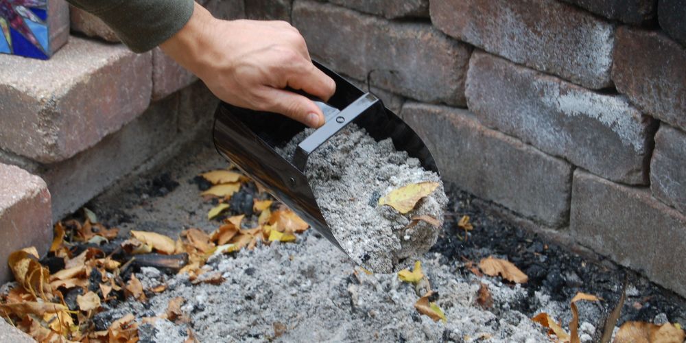 an image of removing ashes from a fire pit